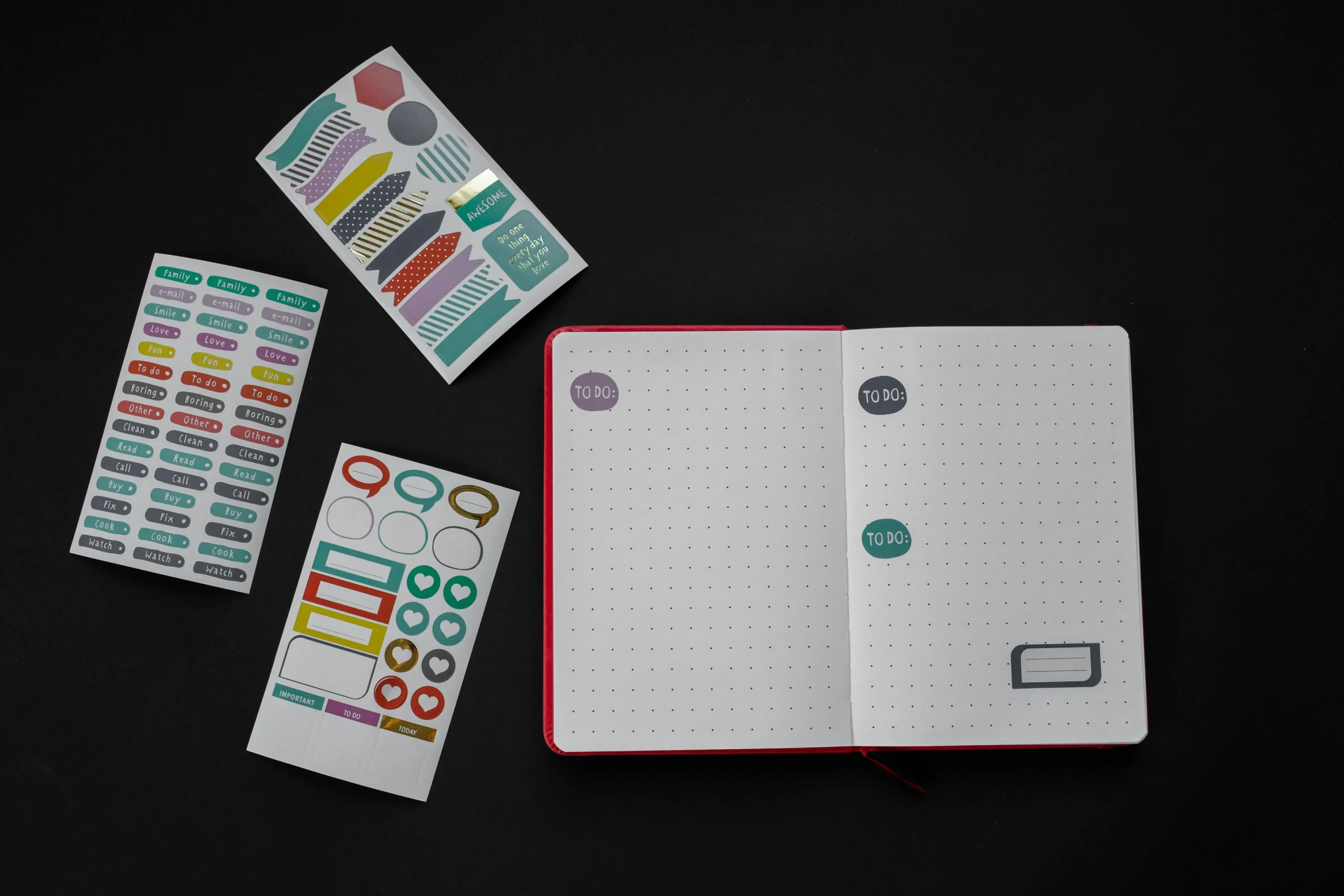 Open dotted notebook with colorful “To Do” stickers and labels on a dark background — representing organized product presentation and clear calls to action that help convert shoppers.