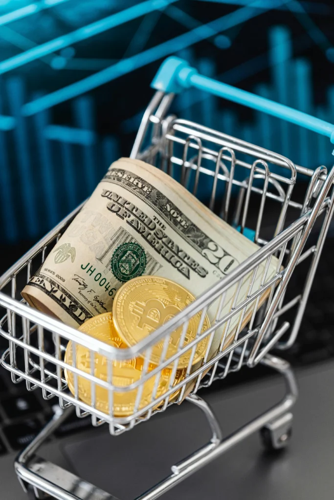 "Mini shopping cart filled with rolled U.S. dollar bills and Bitcoin coins, representing digital assets and inflation hedge debate in modern finance."