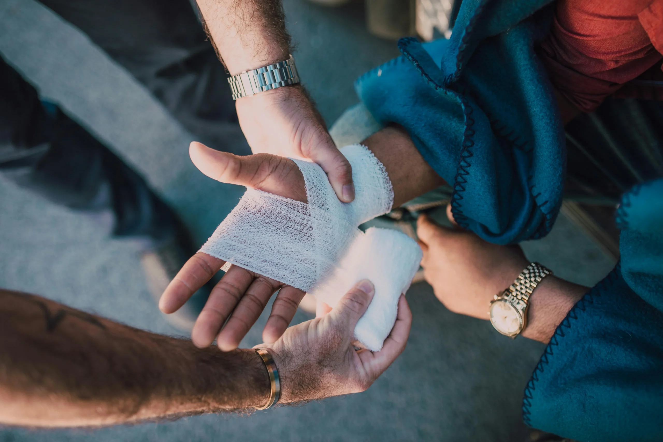 "Injured hand being treated and bandaged, representing physical harm in a motorcycle accident and the role of a lawyer in recovering compensation."